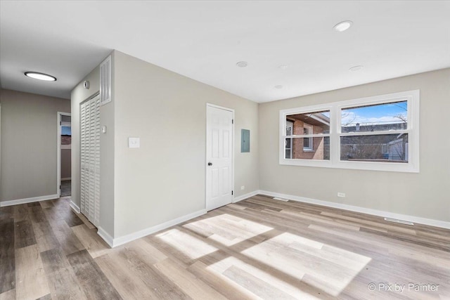 entrance foyer featuring electric panel and light wood-type flooring