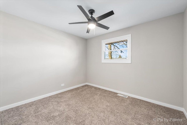 carpeted empty room with ceiling fan