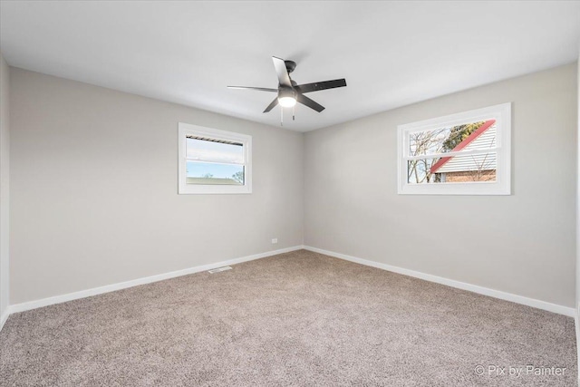 empty room with carpet floors and ceiling fan