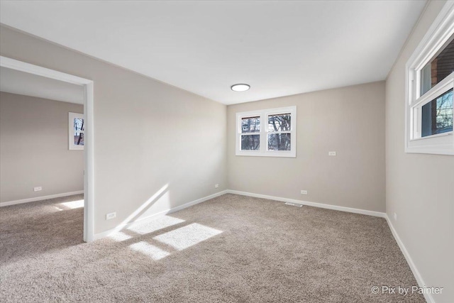 spare room featuring carpet floors