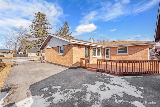 back of house featuring a wooden deck