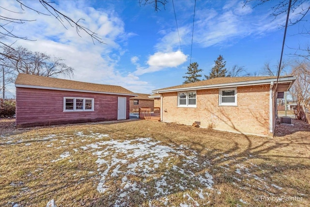 rear view of property with a yard