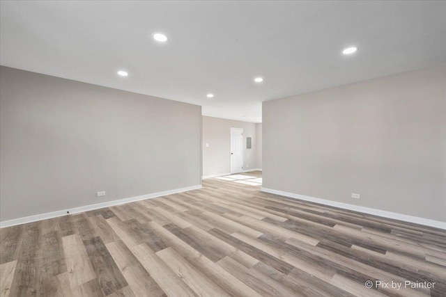 spare room featuring light wood-type flooring