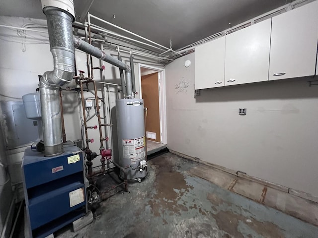 utility room featuring water heater