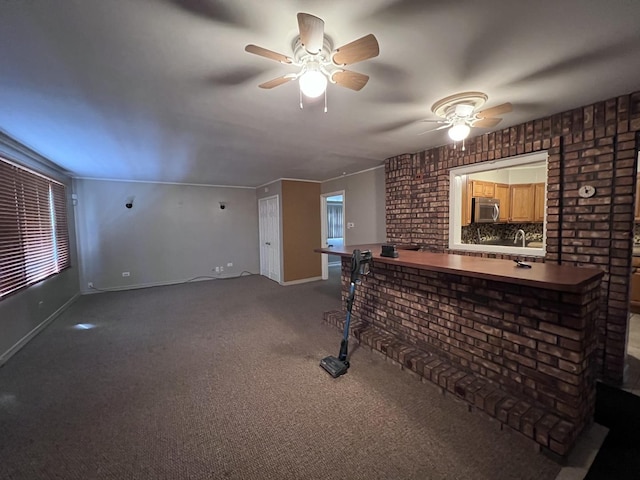 bar featuring ornamental molding, ceiling fan, brick wall, carpet, and backsplash