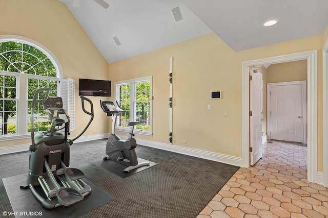 workout room with vaulted ceiling and plenty of natural light