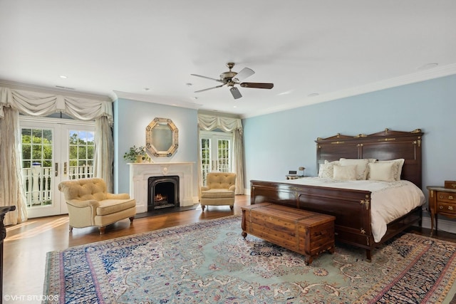 bedroom with crown molding, ceiling fan, multiple windows, access to outside, and french doors