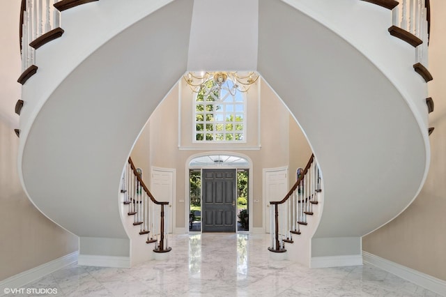 foyer with a towering ceiling