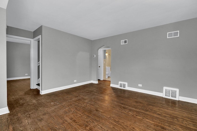 empty room featuring dark hardwood / wood-style flooring