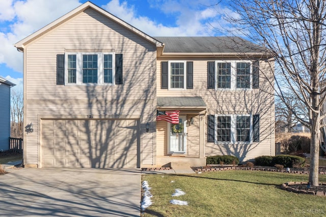 view of front of property with a garage and a front lawn