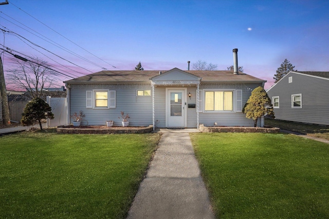 view of front of house with a lawn