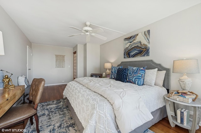 bedroom with hardwood / wood-style flooring and ceiling fan