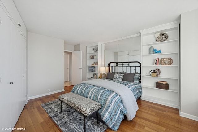 bedroom featuring hardwood / wood-style flooring