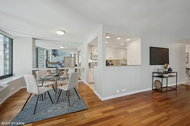 dining space featuring light wood-type flooring