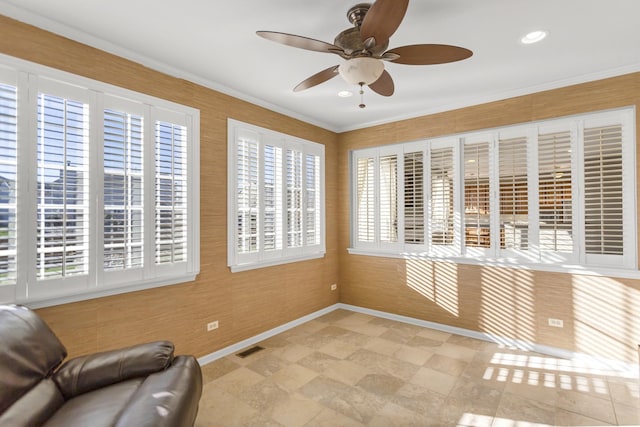 unfurnished room featuring crown molding and ceiling fan