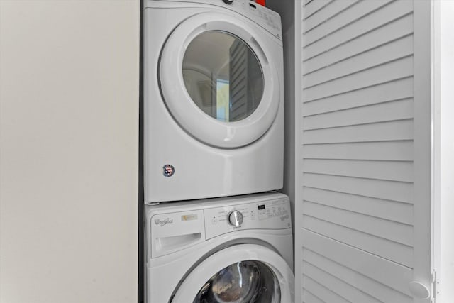 laundry area with stacked washer / drying machine