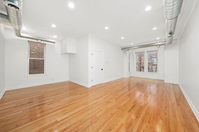 unfurnished living room with light wood-type flooring