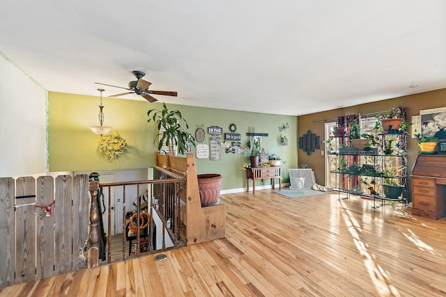 interior space with light hardwood / wood-style floors and ceiling fan