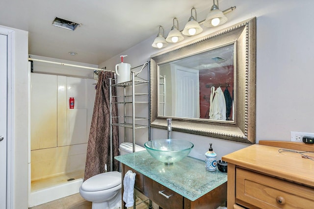 bathroom with a shower with shower curtain, toilet, and sink