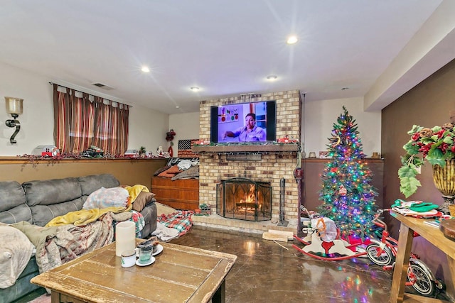 living room with concrete flooring and a fireplace