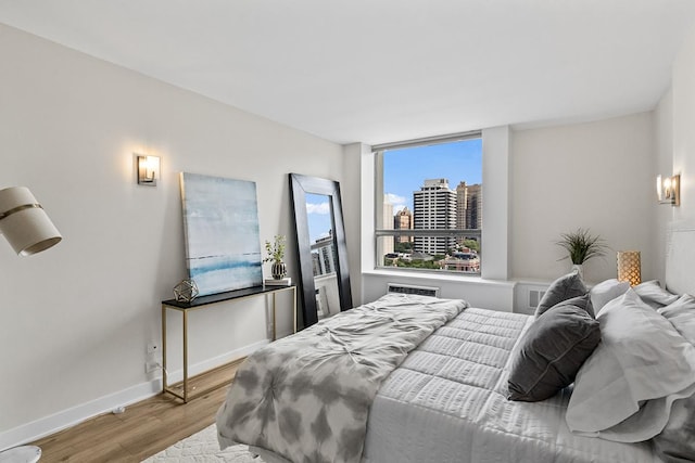 bedroom with light wood-type flooring