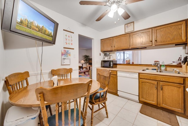 kitchen with sink, ceiling fan, dishwasher, and light tile patterned flooring