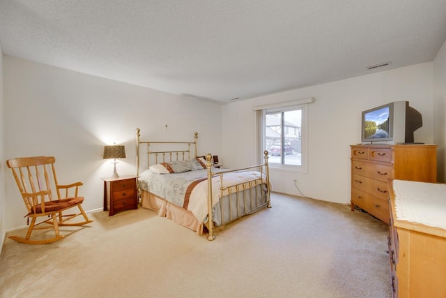 bedroom with light carpet