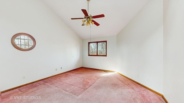 carpeted empty room featuring ceiling fan and high vaulted ceiling