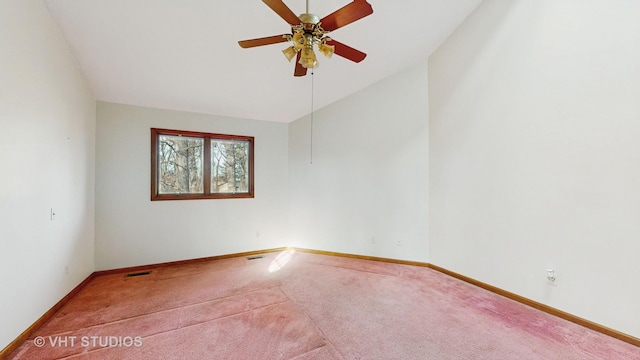 unfurnished room featuring vaulted ceiling, ceiling fan, and carpet floors