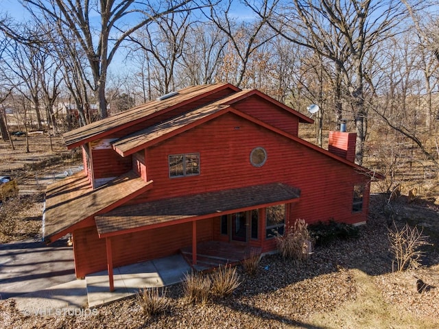 view of side of property featuring a patio area