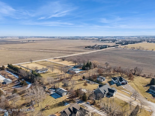 birds eye view of property with a rural view