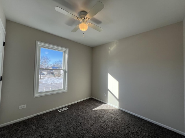 spare room with ceiling fan and carpet floors