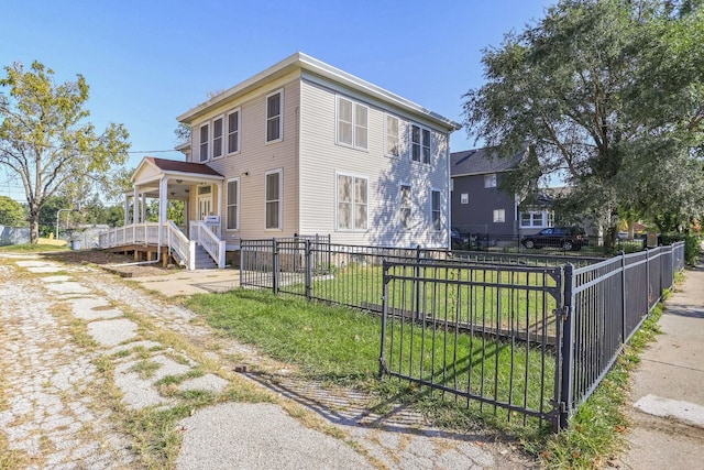 view of property exterior featuring a porch and a yard