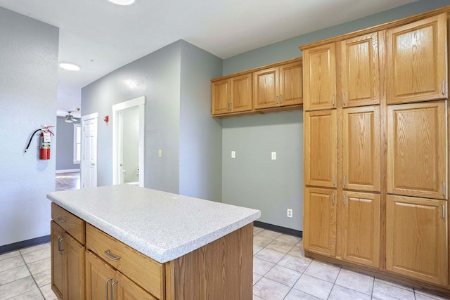 kitchen with a kitchen island and light tile patterned floors