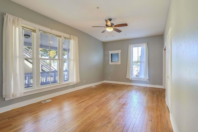 unfurnished room with ceiling fan and light hardwood / wood-style floors