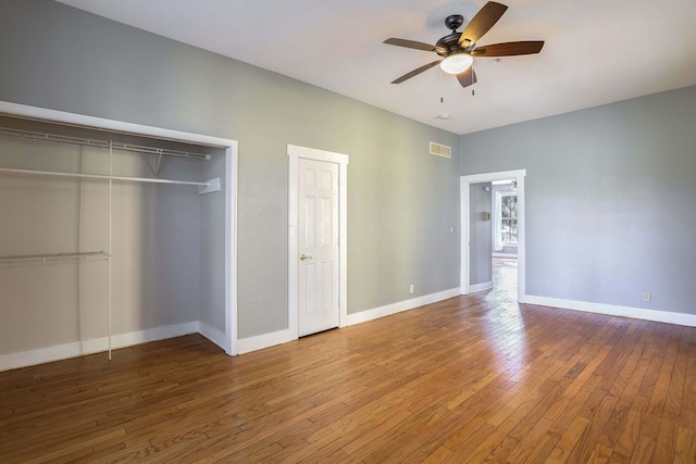 unfurnished bedroom with hardwood / wood-style flooring and ceiling fan