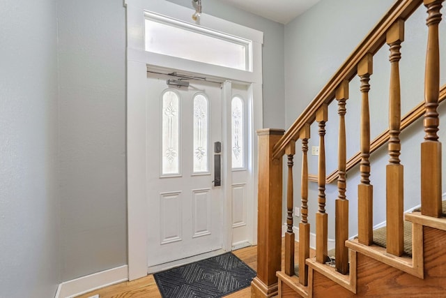 entryway with plenty of natural light and light wood-type flooring