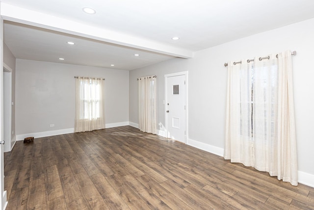 unfurnished room featuring dark hardwood / wood-style flooring