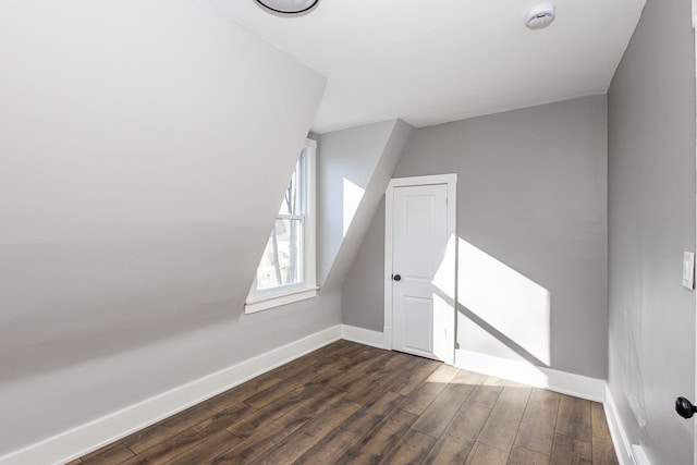 bonus room with dark hardwood / wood-style flooring