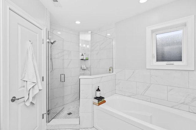 full bath featuring recessed lighting, visible vents, a garden tub, and a shower stall