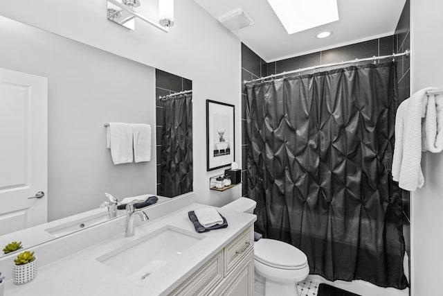 full bathroom with a skylight, curtained shower, vanity, and toilet