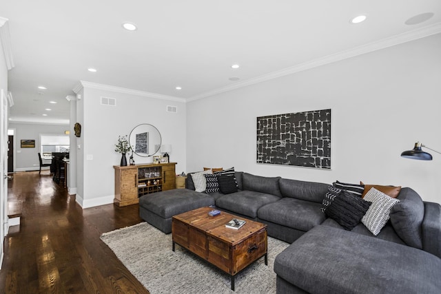 living area featuring recessed lighting, wood finished floors, visible vents, baseboards, and crown molding