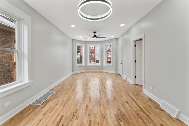 spare room featuring ceiling fan and light hardwood / wood-style floors