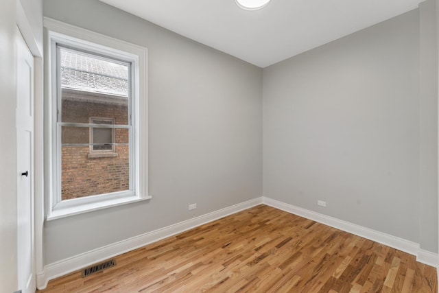 empty room with light hardwood / wood-style floors