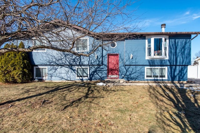 bi-level home with a front yard