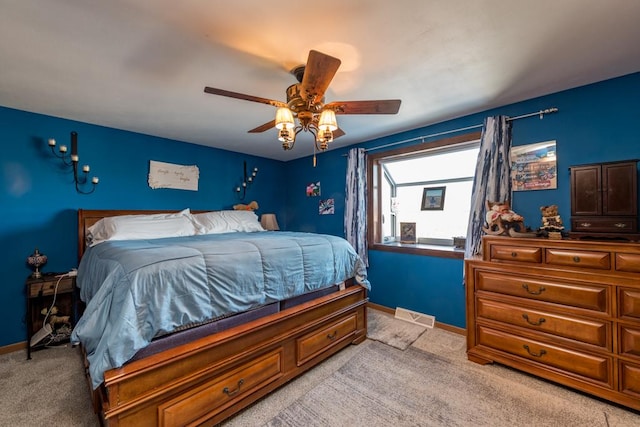 bedroom with light colored carpet and ceiling fan