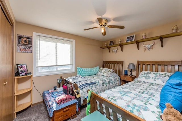 bedroom featuring carpet floors, ceiling fan, and a closet