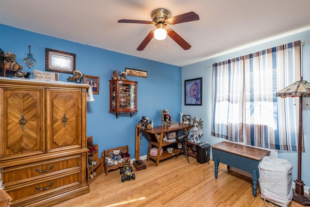 interior space featuring ceiling fan and light hardwood / wood-style flooring