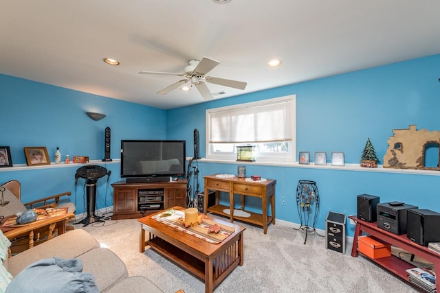 carpeted living room with ceiling fan