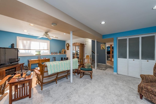 living room featuring carpet floors and ceiling fan